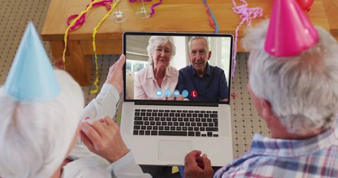 Elderly Couple Video Calling During Home Celebration