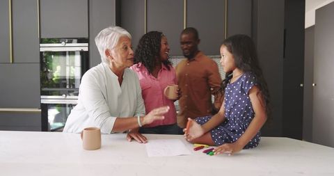 Multigenerational Family Sharing Warm Moment Around Marble Kitchen Island