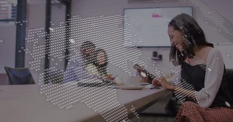 Smiling Businesswoman Using Smartphone with Digital World Map Overlay