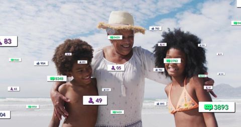 Grandmother enjoying beach day with grandchildren while social media reactions float around