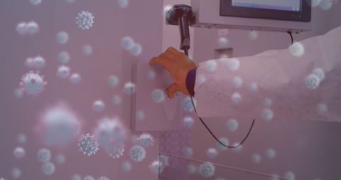 Scientist hand entering passcode with overlay of virus cells