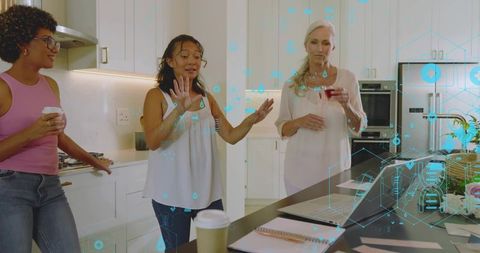 Asian woman manipulating holographic ar interface at modern kitchen island with colleagues