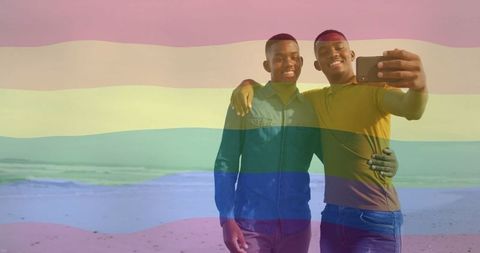 Happy couple embracing and taking selfie with rainbow overlay