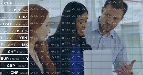 Multinational Team Analyzing Currency Data in Corporate Office