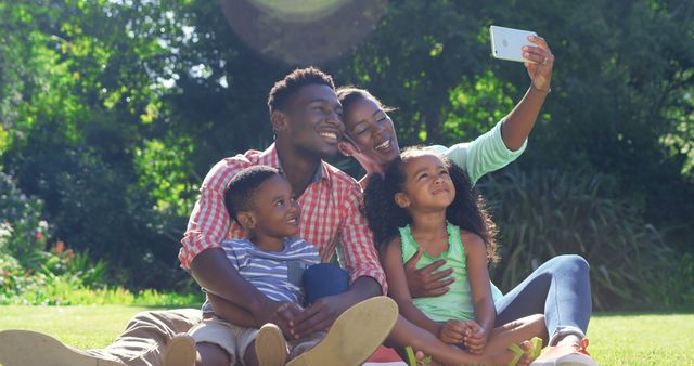 Happy Family Taking Selfie in Sunny Park - Download Free Stock Images Pikwizard.com