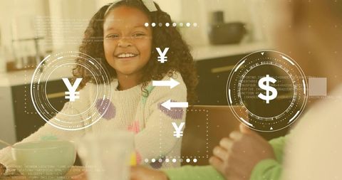 Smiling girl wearing pom-pom sweater using virtual currency HUD at cozy kitchen table