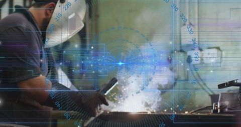 Welder precision craftsmanship in modern workshop