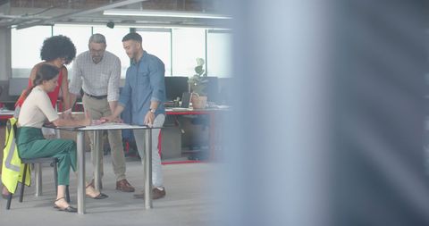 Diverse Engineering Team Collaborating in Modern Office