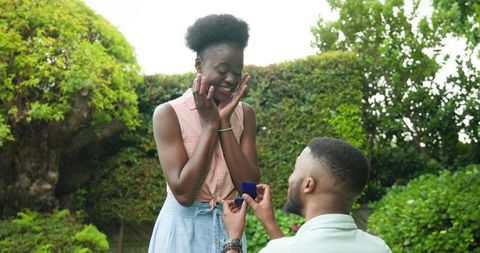 Romantic marriage proposal in peaceful garden setting