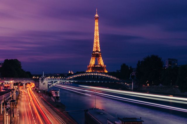 Eiffel Tower at Dusk with Vibrant Light Trails - Download Free Stock Photos Pikwizard.com