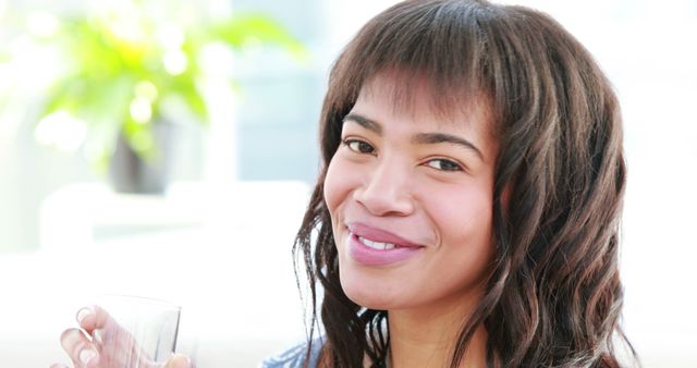 Smiling Woman Holding Glass Indoors - Download Free Stock Images Pikwizard.com