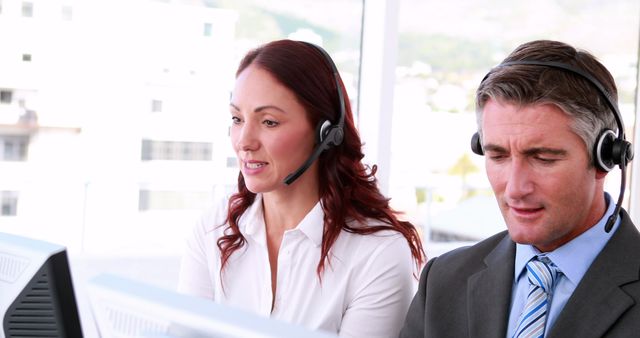 Customer Service Representatives Working at Computer Desks with Headsets - Download Free Stock Images Pikwizard.com