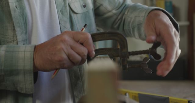 Carpenter Working with Clamp Tool in Workshop - Download Free Stock Images Pikwizard.com