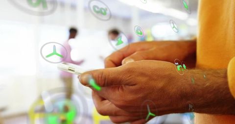 Hands Operating Smartphone with Abstract Digital Icons