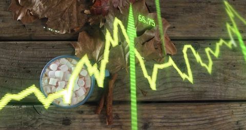 Rustic autumn mug showing marshmallows and cinnamon with leaves on weathered wood neon data graph