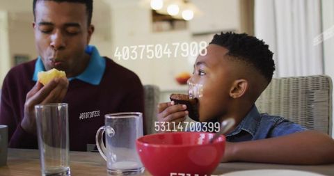 Father and Son Enjoying Snacks with Intriguing Overlay