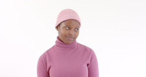 Woman in Pink Attire Smiling in White Space
