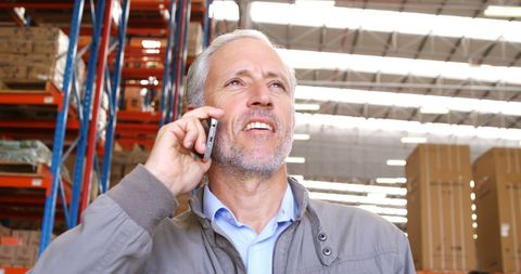 Senior Manager Communicating Efficiently in Warehouse Environment - Download Free Stock Images Pikwizard.com