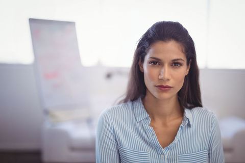 Confident business woman in modern office space