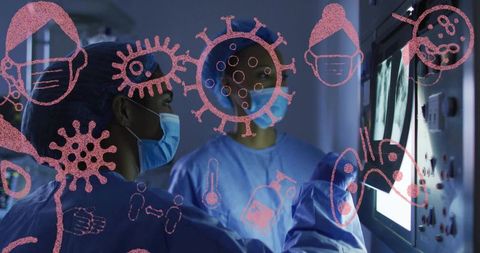 Medical team reviewing X-ray on monitor with virus overlay wearing PPE in radiology suite