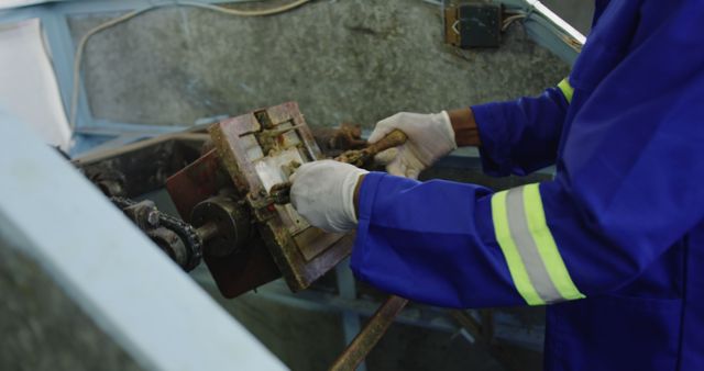 Technician Repairing Machinery Wearing Protective Gloves - Download Free Stock Images Pikwizard.com