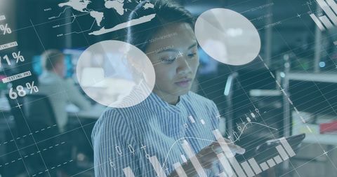 Businesswoman Analyzing Data on Digital Tablet in Modern Office