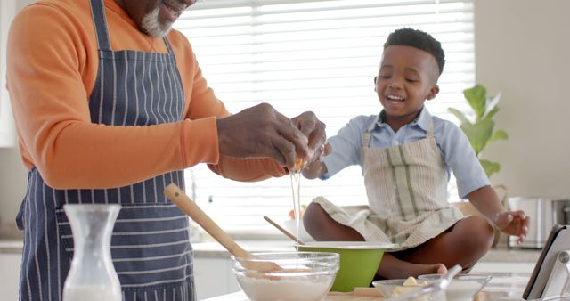 Grandfather Baking with Happy Grandson in Kitchen - Download Free Stock Images Pikwizard.com