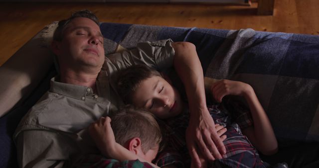 Father Cozy with Sons Sleeping on Comfortable Couch at Home - Download Free Stock Images Pikwizard.com