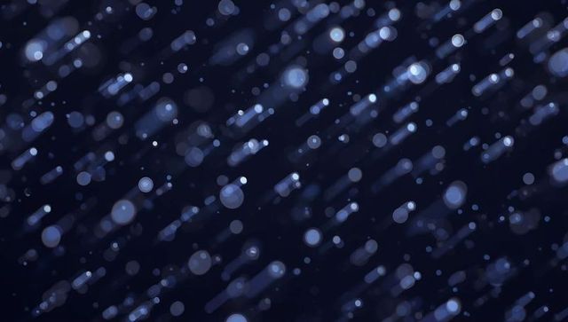 Ambient bokeh droplets on dark night sky