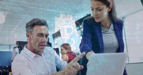 Business professionals discussing cryptocurrency projects in modern office