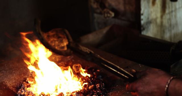 Blacksmith Heating Metal in Glowing Forge Fire - Download Free Stock Images Pikwizard.com