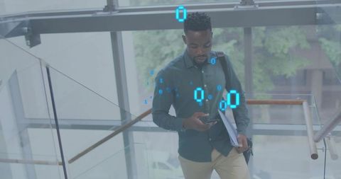 Professional walking down glass staircase using smartphone with blue digital data overlay