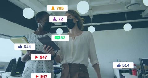 Colleagues with digital social media engagement in modern office