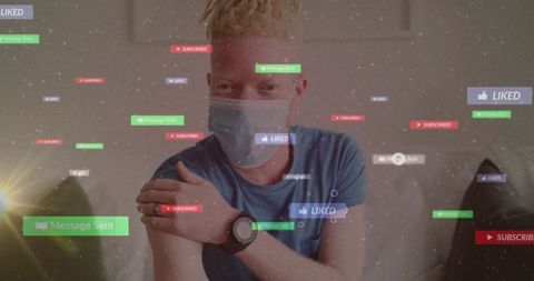 Man engaging in digital communication protected by mask at home