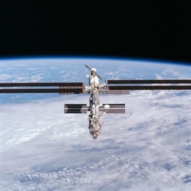STS097-703-037 (9 December 2000) --- This picture is one of a series of 70mm frames exposed of the International Space Station (ISS) following undocking at 1:13 p.m.  (CST), December 9, 2000.  This series of images, as well as video and digital still imagery taken at the same time, represent the first imagery of the entire station with its new solar array panels deployed. Before separation, the shuttle and space station had been docked to one another for 6 days, 23 hours and 13 minutes. Endeavour moved downward from the space station, then began a tail-first circle at a distance of about 500 feet. The maneuver, with pilot Michael J. Bloomfield at the controls, took about an hour.  While Endeavour flew that circle, the two spacecraft, moving at five miles a second, navigated about two-thirds of the way around the Earth. Undocking took place 235 statute miles above the border of Kazakhstan and China. When Endeavour made its final separation burn, the orbiter and the space station were near the northeastern coast of South America.