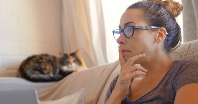Woman Deep in Thought with Cat on Couch - Download Free Stock Images Pikwizard.com