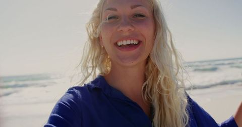 Joyful Woman Smiling on Sunny Beach Adventure