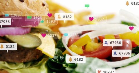 Cheeseburger and fresh salad showing social media notifications overlay for food engagement