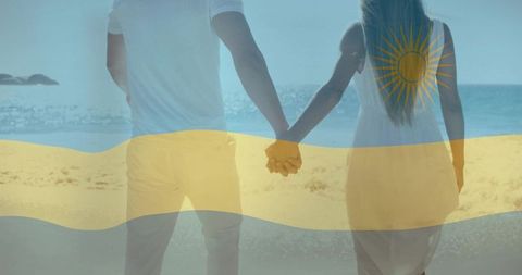 Couple holding hands by ocean overlayed with sun emblem