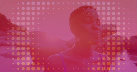 African American Woman Strolling by Beach on Vacation