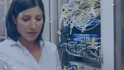 Female IT Technician Managing Server Room Wires