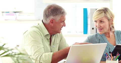 Middle-Aged Professionals Collaborating in Bright Office Setting - Download Free Stock Images Pikwizard.com