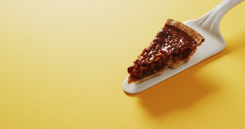 Delicious Slice of Pecan Pie on Bright Yellow Background