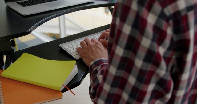 Person Typing on Keyboard in Home Office with Notebook and Laptop - Download Free Stock Images Pikwizard.com