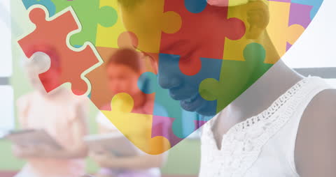 Children Engaged in Learning with Puzzle Symbol for Autism Awareness