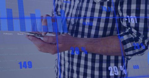 Man holding smartphone while analyzing mobile data with blue hud analytics overlay