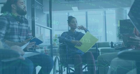 Diverse Team Analyzing Financial Data During Office Meeting