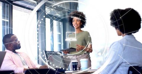 Female Leader Presenting with Tablet in Modern Conference Room with Futuristic HUD Overlay