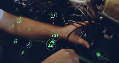 Mechanic Using Smart Technology to Enhance Engine Efficiency