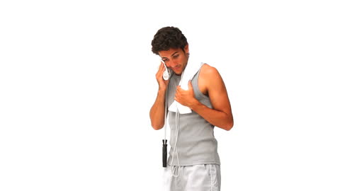 Athletic Man with Jump Rope Resting Post-Workout